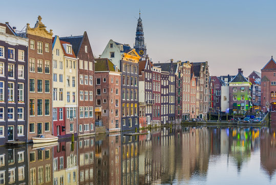 The Damrak Canal In Amsterdam, Netherlands.