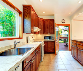 Bright kitchen with carved wood cabinets