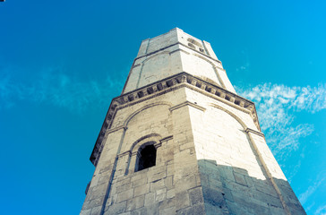 Obraz premium The old tower is looking at the sky