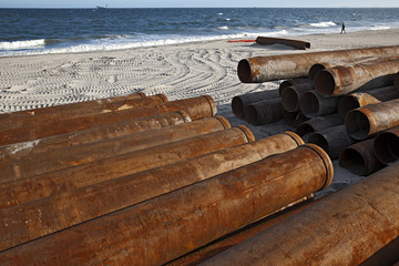 rusty pipes along the sea beach