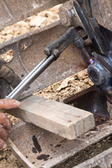 Fixing bulldozer wheel with gas cutting torch