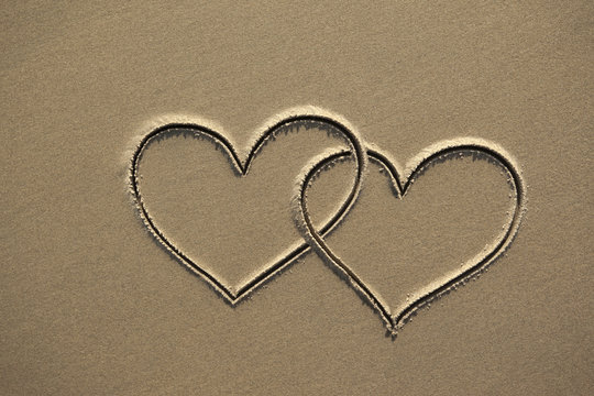images of hearts in the sand