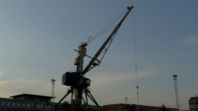 Big crane on standby on a dusky afternoon in the port GH4 4K UHD