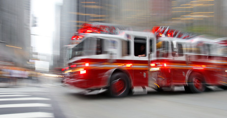 fire trucks and firefighters brigade in the city