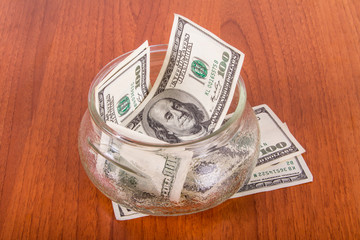 Dollar Banknotes in Glass Bowl