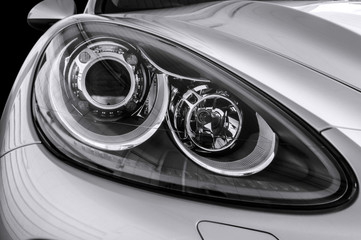 Closeup headlights of car.