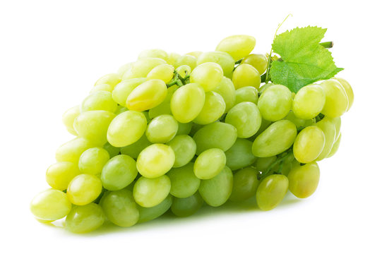 Fresh green grapes with leaves.
