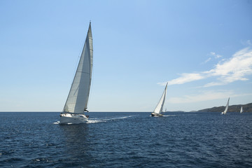 Fototapeta na wymiar Sailing yacht on the race in a sea.
