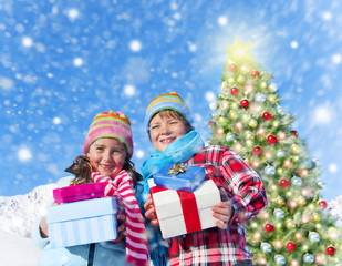 Fototapeta na wymiar Children Holding Gift Boxes with Christmas Tree