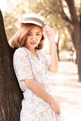 Beautiful Vintage girl wandering in park with wind blow