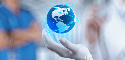 Medical Doctor holding a world globe in her hands as medical net