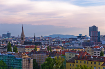 Fototapeta na wymiar Vienna cityscape at sunset, different ages, styles and colors