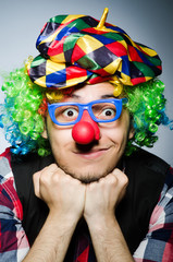 Funny clown against the dark background