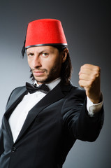 Man in traditional turkish hat and dress