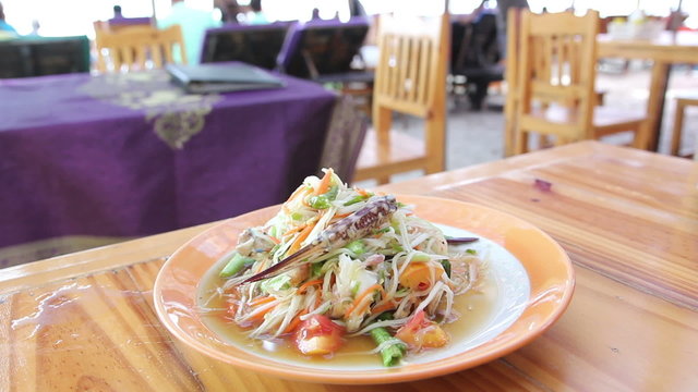 Serve papaya salad Som Tam at the restaurant beach