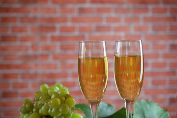 Grapes and two glasses of the white wine