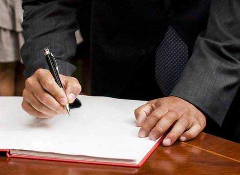 Man signing documents