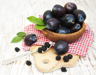 Fresh purple plums and blackberry