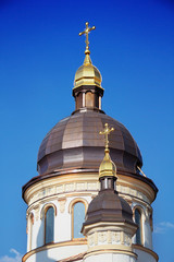 Fototapeta na wymiar Church domes with golden crosses