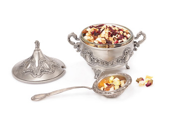 Dried fruit tea in a metal container with selective focus effect