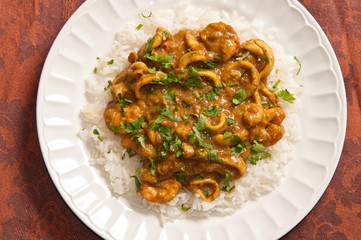 Delicious sea food curry with mango, coconut milk and white rice as side (zenith photo)