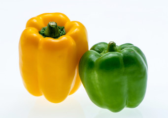Orange and green bell peppers. on white background