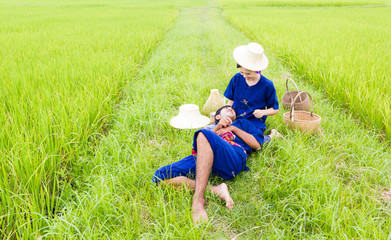 Naklejka na ściany i meble Portrait of a Thai Farmer in the Rice Field