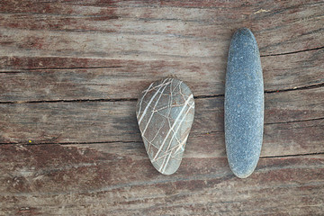 stones on a wooden background