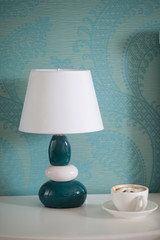 bedside table lamp and coffee cup