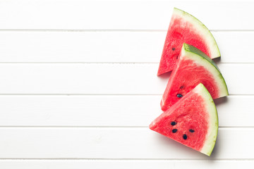 sliced watermelon on kitchen table - obrazy, fototapety, plakaty