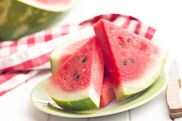sliced watermelon on kitchen table
