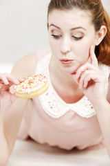 Woman eating a doughnut