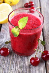 Fresh cold cherry cocktail with mint and lemon