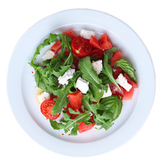 Salad with watermelon, feta, arugula and basil leaves