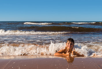 Boy is having fun on beach