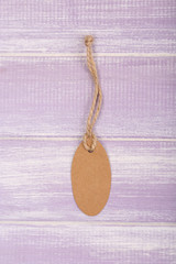 empty tag on purple wooden background