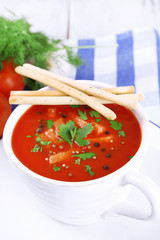 Tasty tomato soup with croutons on table close-up