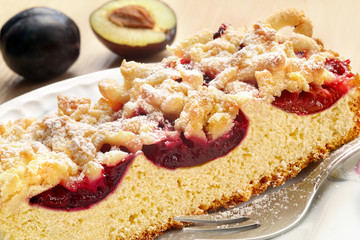 Baked cake with plums and crumble