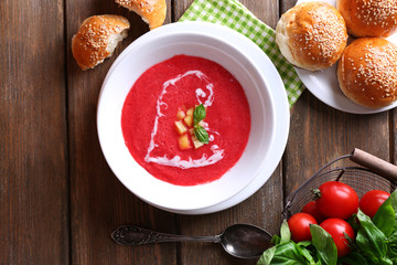Gazpacho soup on color wooden background