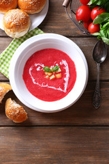 Gazpacho soup on color wooden background