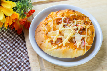 Pizza with crab on table.