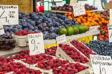 Red raspberries in boxes at local farm market in Poland.