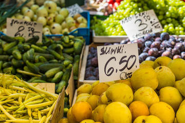 Plums on the market stand in Poland.