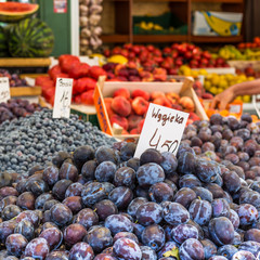 Plums on the market stand in Poland.