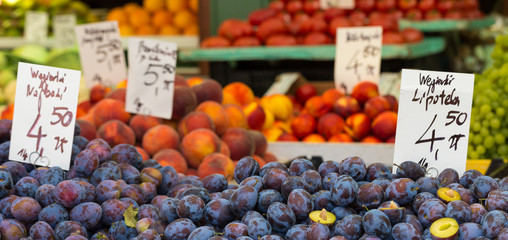 Plums on the market stand in Poland.