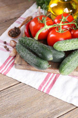 Fresh vegetables with herbs and spices on table, close-up