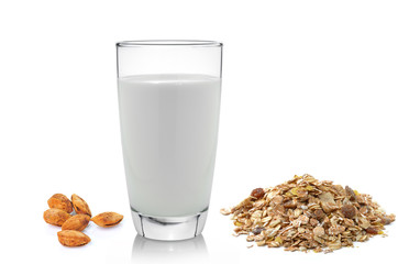 fresh milk in the glass almond and muesli breakfast placed on wh
