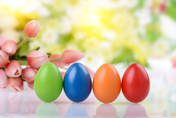 Fototapeta na wymiar decorated eggs and spring flowers