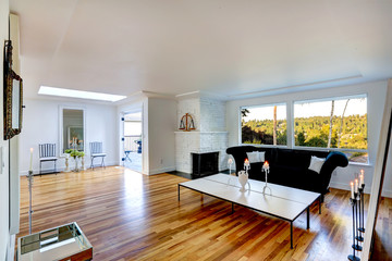 Bright living room interior with white brick fireplace