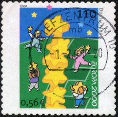 stamp printed in the Germany shows Children and Stars